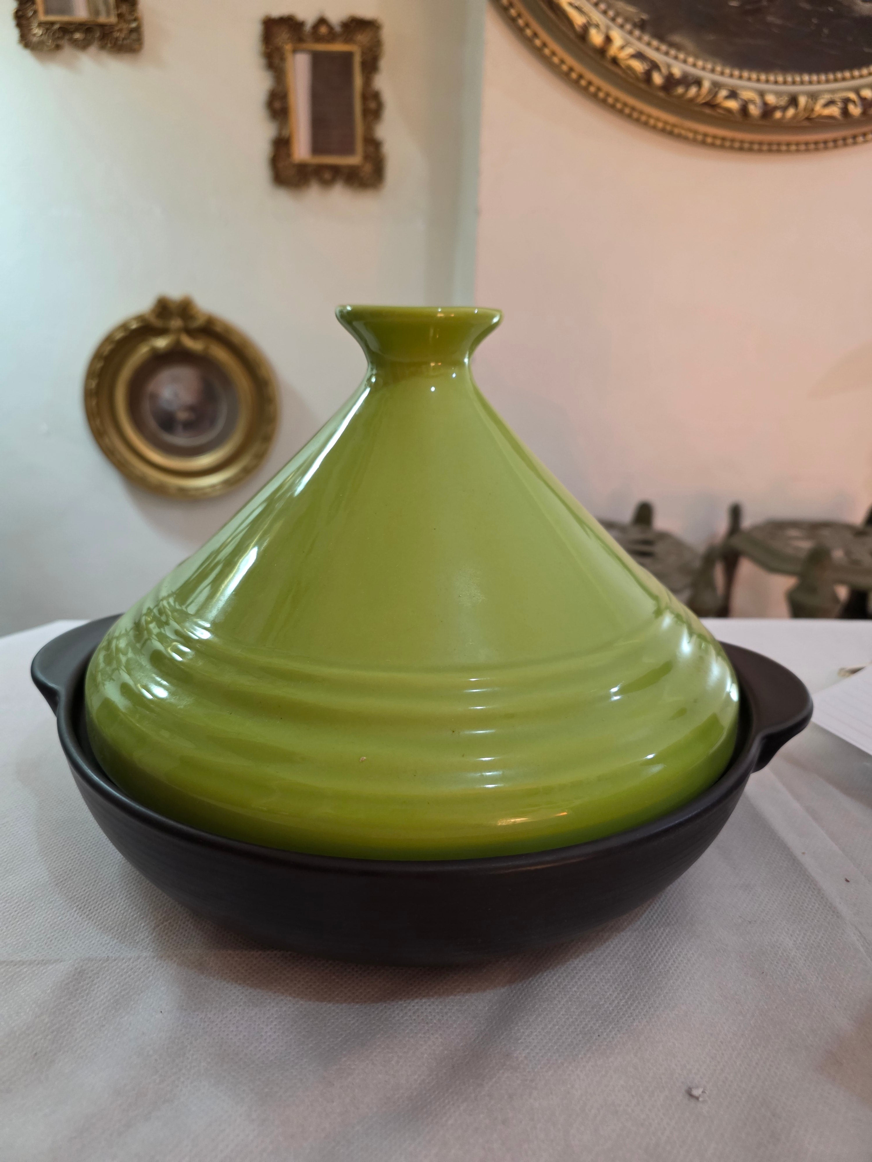 A pop of color for your Table: ceramic tagine with vivid green lid.