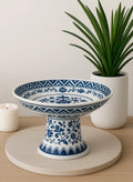 A timeless Bleu Blanc porcelain pedestal bowl