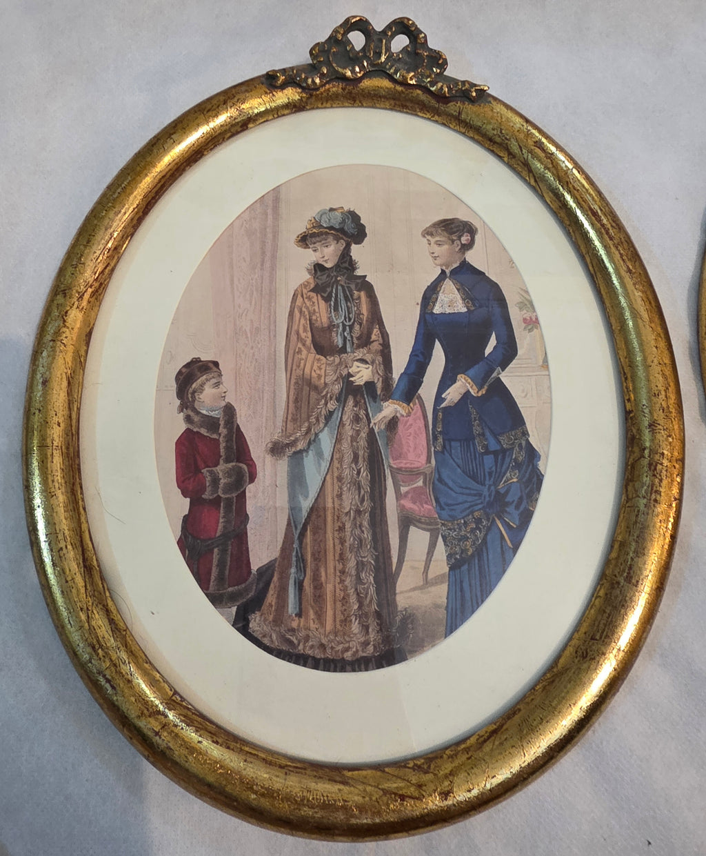 Victorian Elegance in Gilded Oval Frames