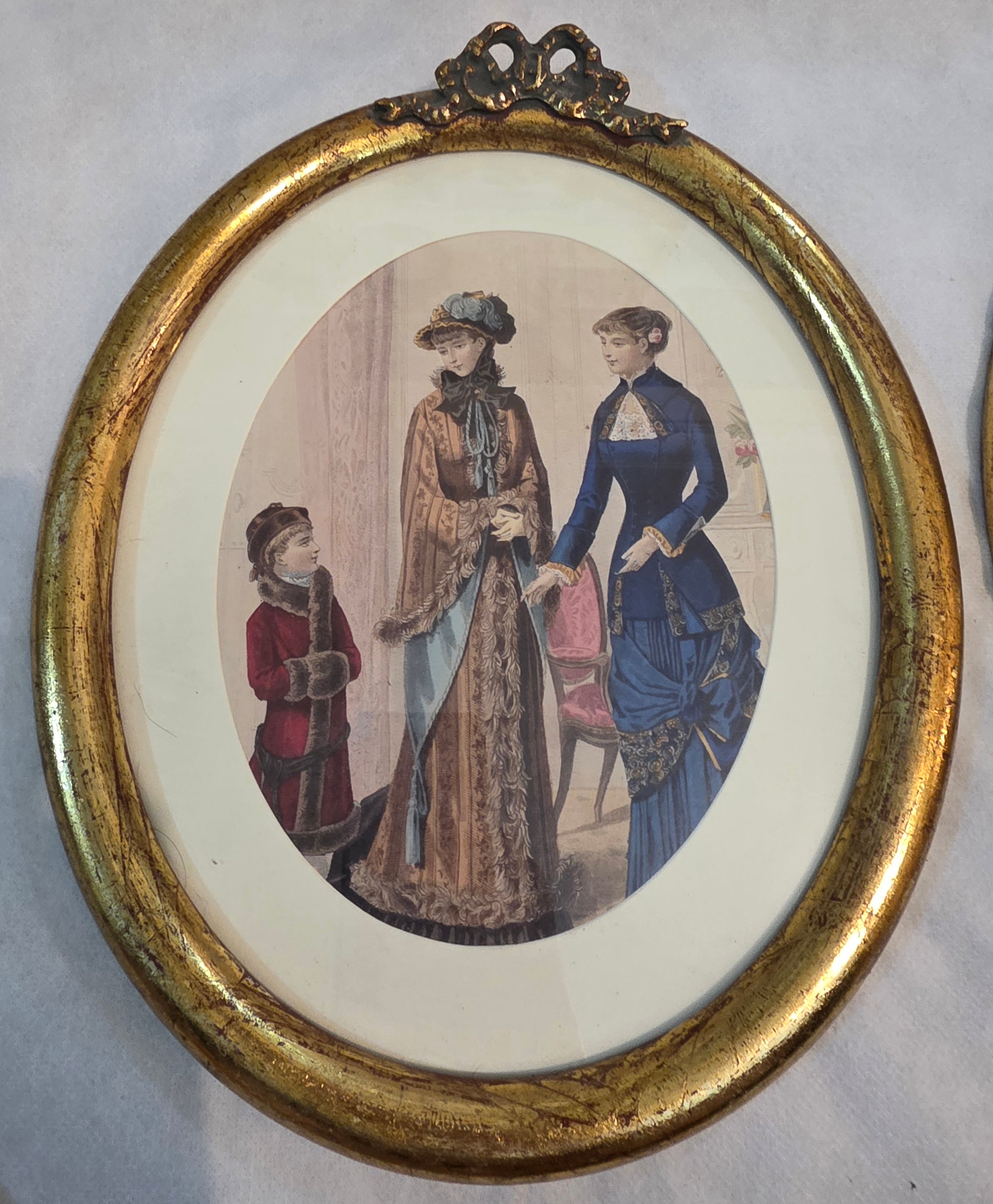 Victorian Elegance in Gilded Oval Frames
