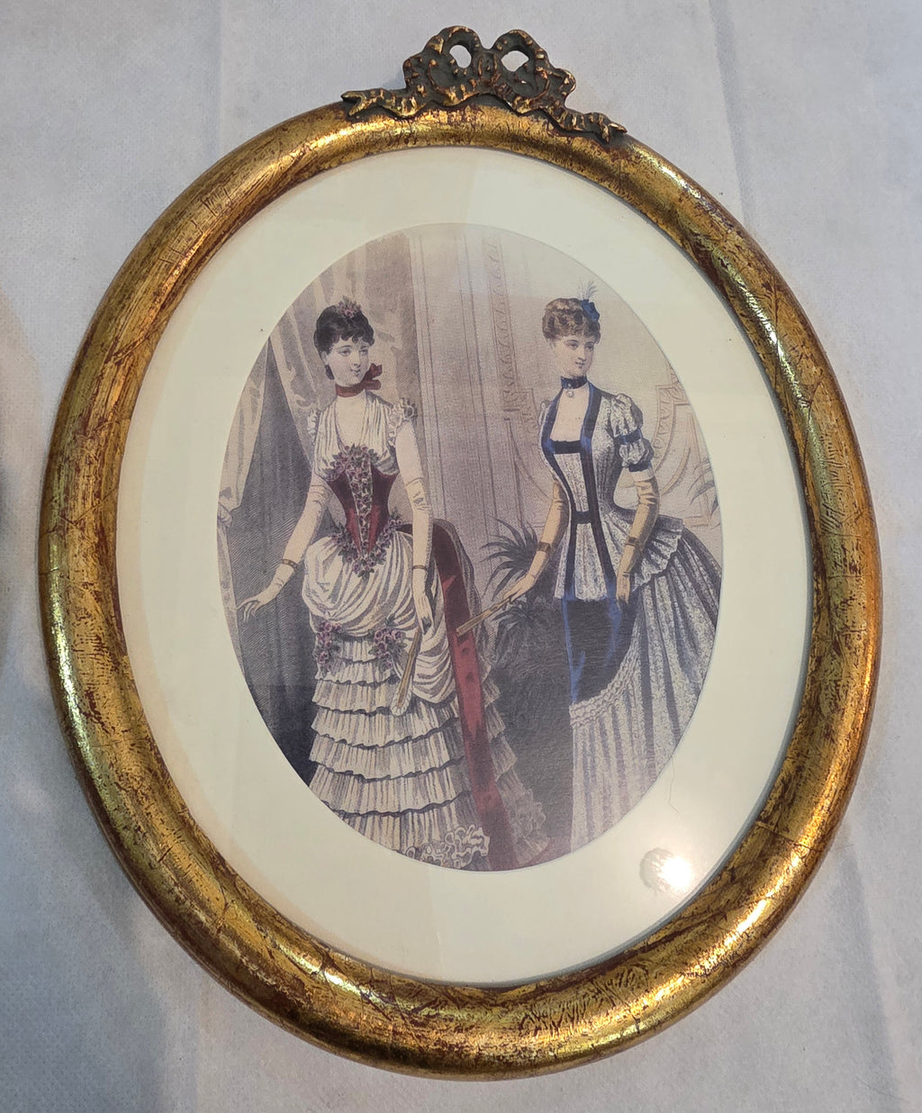 Victorian Elegance in Gilded Oval Frames