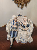 Vintage Porcelain Couple Figurine on Sofa – Blue & Gold Accents