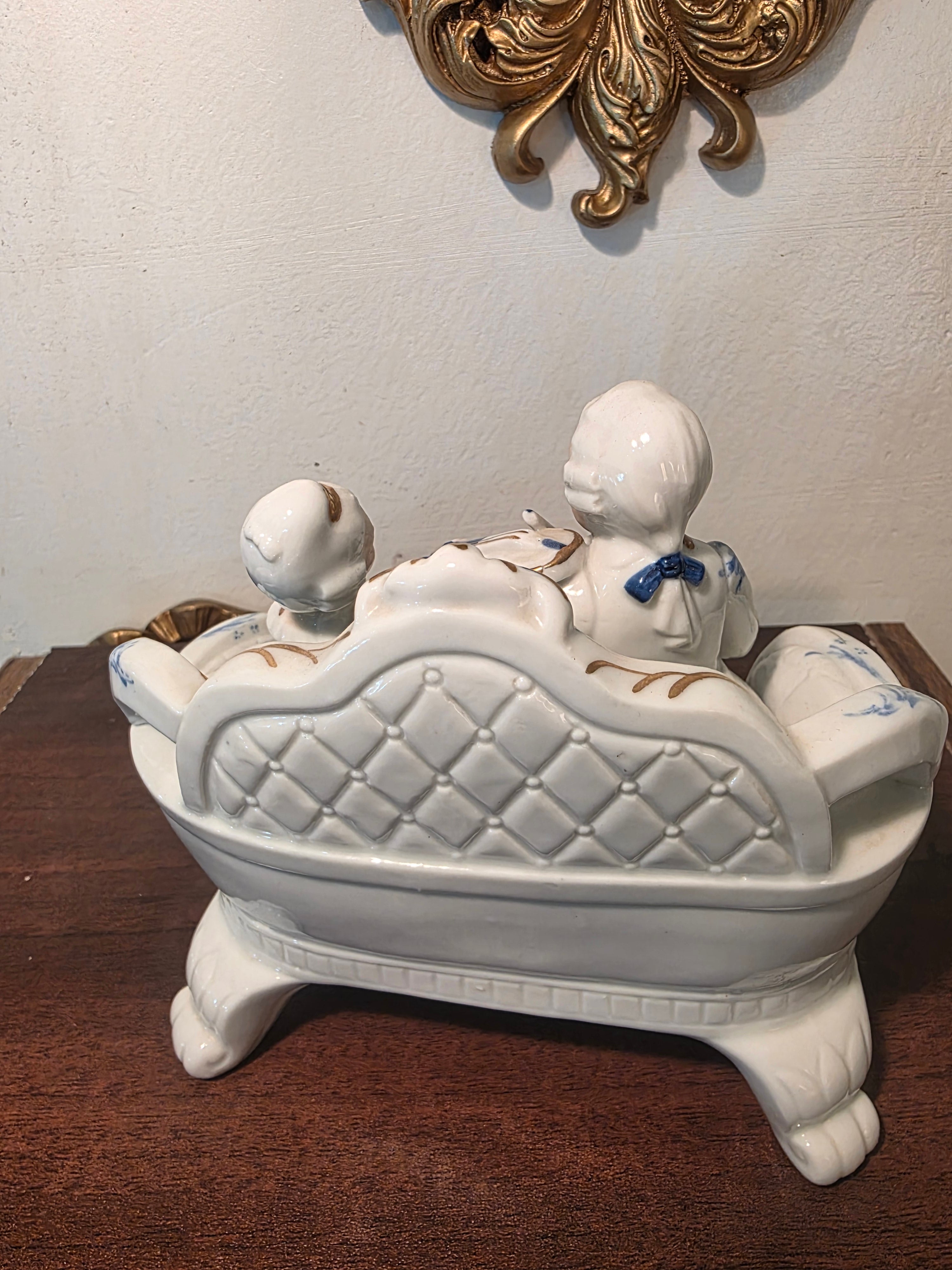 Vintage Porcelain Couple Figurine on Sofa – Blue & Gold Accents