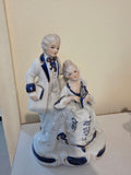 Mid-Century Rococo Style Porcelain Colonial Couple Statue with Gold Accents