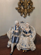 Vintage Porcelain Couple Figurine on Sofa – Blue & Gold Accents