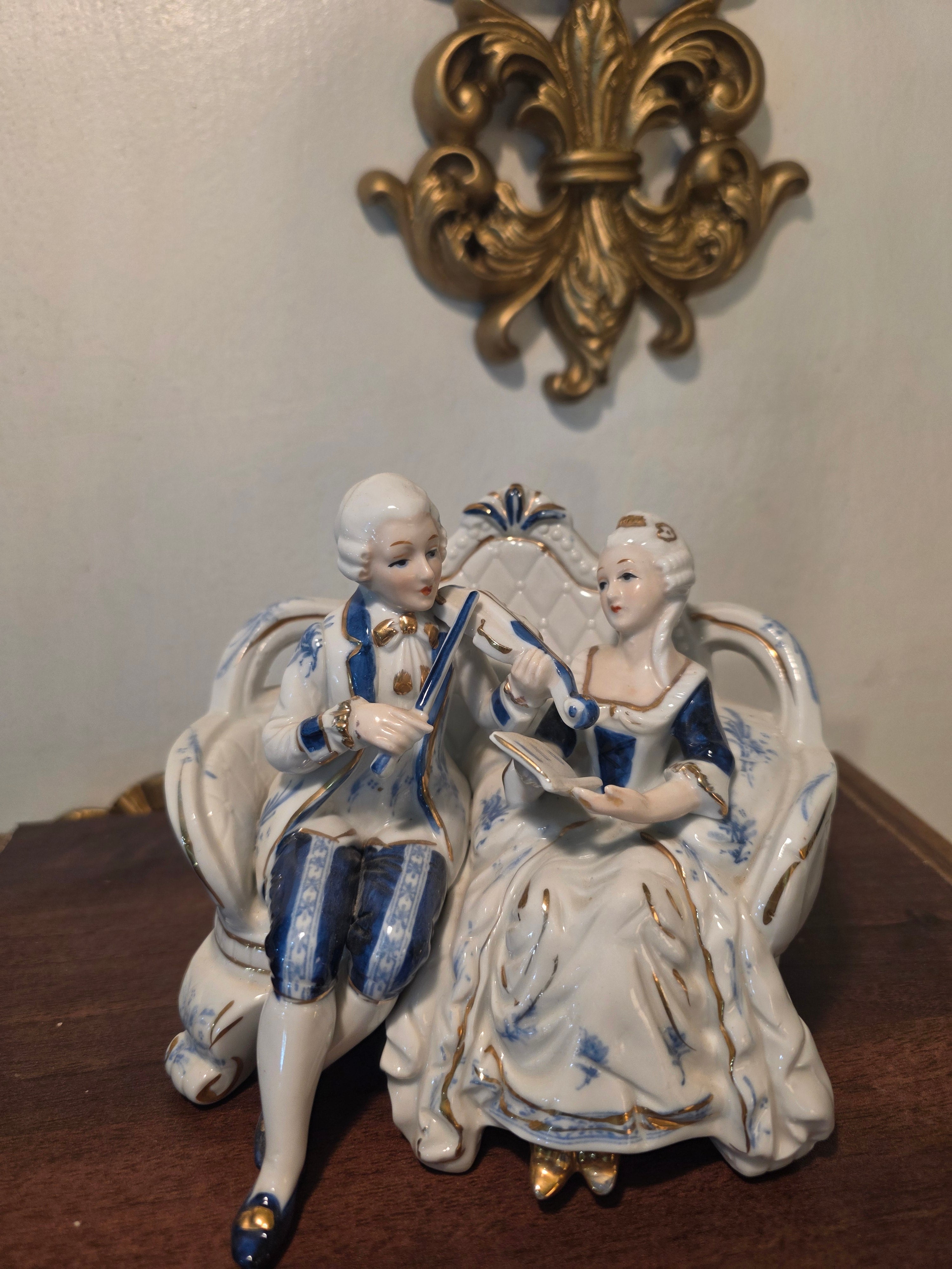 Vintage Porcelain Couple Figurine on Sofa – Blue & Gold Accents